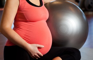 Pregnant woman doing relaxation exercise